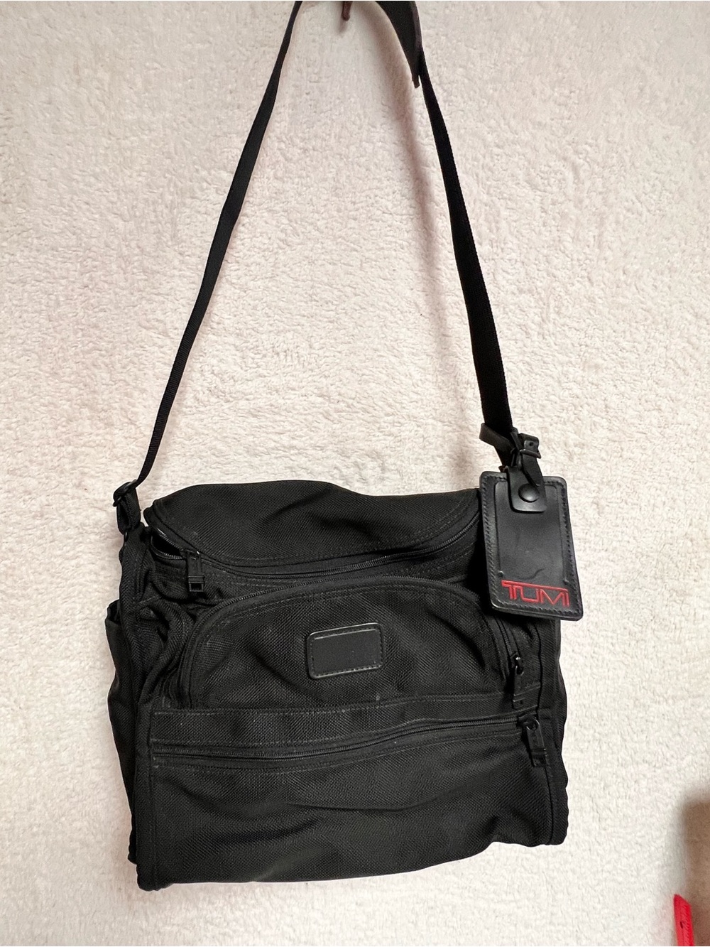 Tumi Black Nylon Messenger Bag with Red Logo Tag